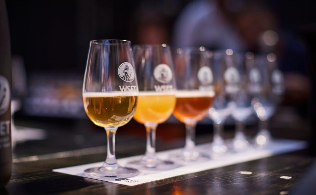 Beers of different colours in WSET branded glasses