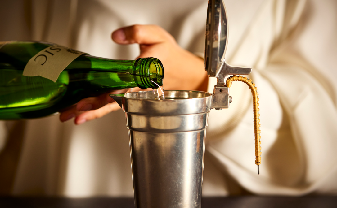 Sake being warmed in a metal jug