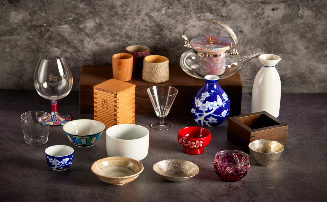 A variety of glass and ceramic vessels in various colours