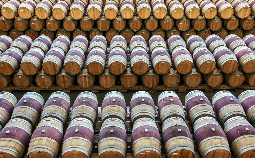 Wooden wine barrels stacked in rows