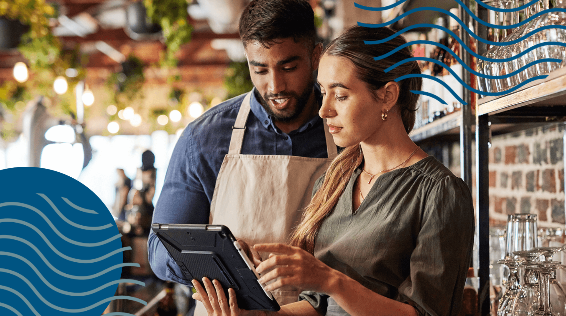 Two colleagues working in a bar