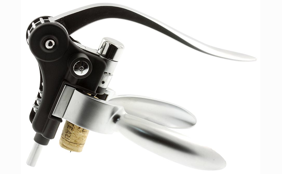 A lever corkscrew, closed, with a cord on the screw.